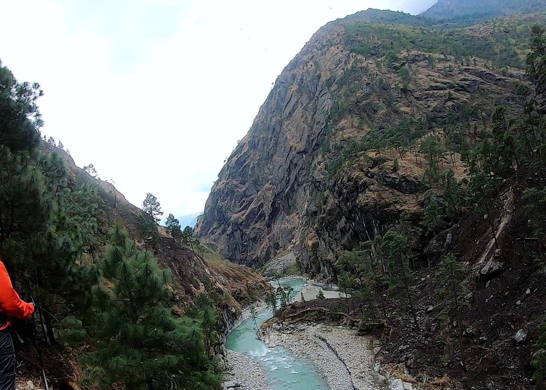 Scenic gorge of the Budhi Gandaki River flowing between towering mountains on the Manaslu Circuit Trek in Nepal