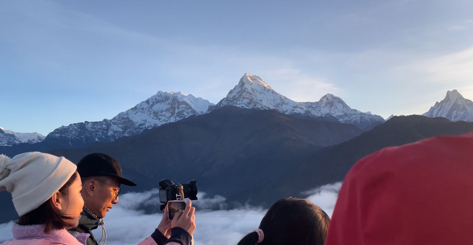 Poon Hill view (3210m / 10531ft) on Annapurna Sanctuary Trek, showing sunrise over Annapurna and Dhaulagiri mountains.