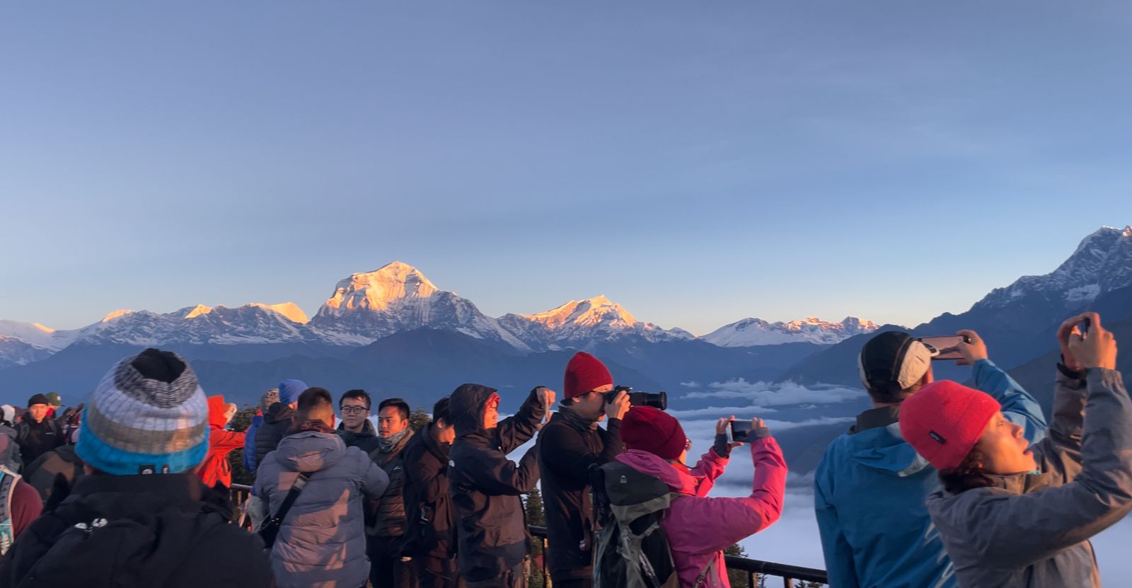 Sunrise over Dhaulagiri range from Poon Hill viewpoint on Annapurna Sanctuary Trek in Nepal.