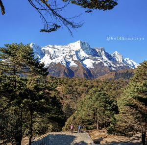 Snow-covered Himalayan peak with clear blue sky along the Everest Base Camp trek.