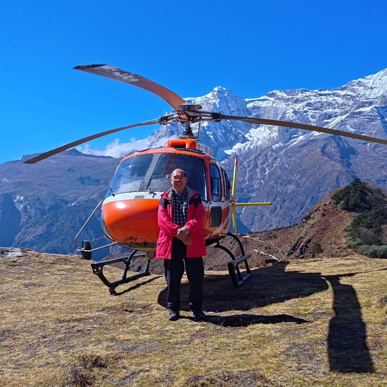 Enjoying Satisfied Client infrom of Helicopter During Everest Base Camp Helicopter Tour