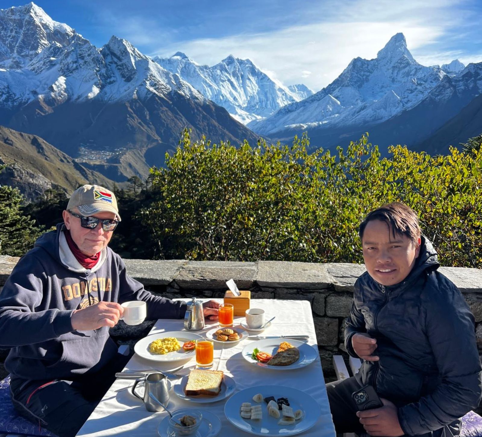 Having breakfast at Everest View Hotel with Everest, Lhotse, Ama Dablam, and Nuptse in view – Luxury Everest View Trek