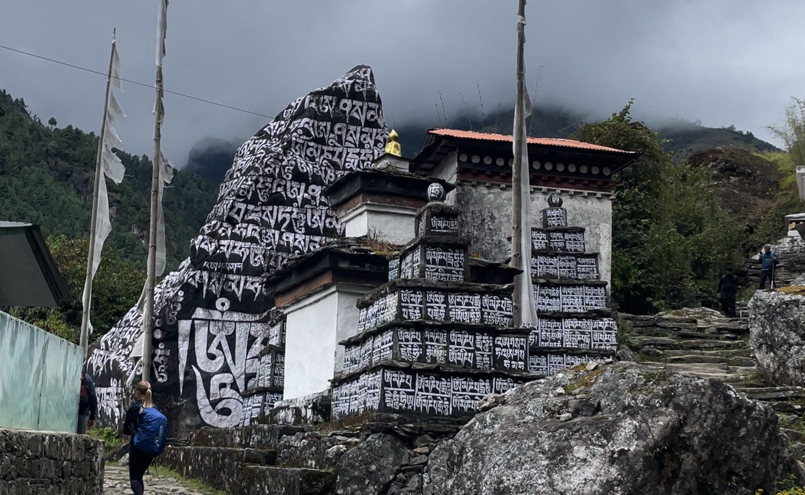 Intricate Buddhist chain carved in stone along the Everest View Trek.
