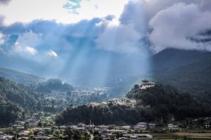 Scenic view of Bumthang Valley in central Bhutan, showcasing lush landscapes, traditional villages, and ancient monasteries