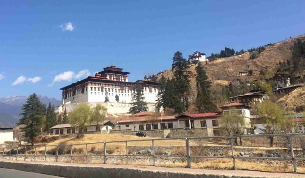 A panoramic view of Rinpung Dzong, a traditional Bhutanese fortress, seen during the Druk Path trek