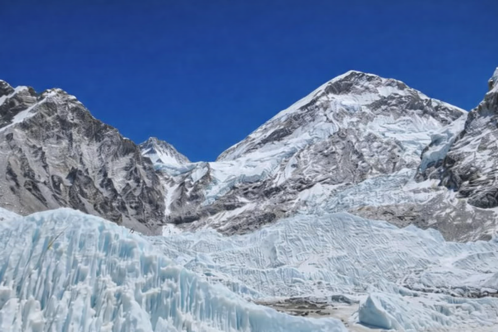 Massive blue ice formations near the Everest Icefall on the Everest Base Camp Trek with Kongma La Pass in Nepal.