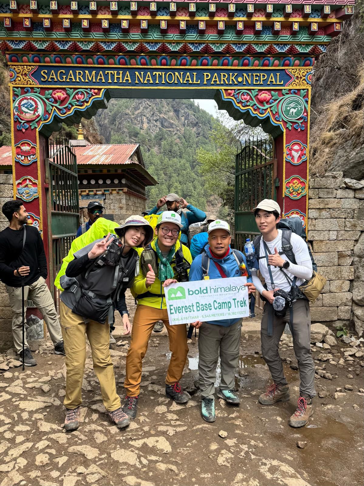 Trekkers capturing pictures in front of the Sagarmatha National Park gate at the start of the Everest Base Camp trek