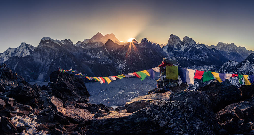 Gokyo Ri sunrise trek view with golden sunlight over Mount Everest, Cho Oyu, and turquoise Gokyo Lakes in Nepal