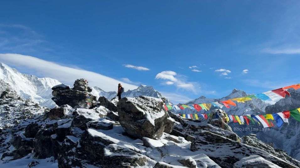 Trekkers standing in between Himalayas and enjoying the breathtaking views, during Gokyo Lake Trek