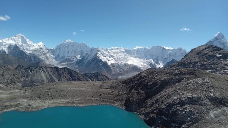 Stunning glacial Kongma La Pass Lake (5,535 m / 18,159 ft) with Himalayan peaks in the background, Everest Three Pass Trek