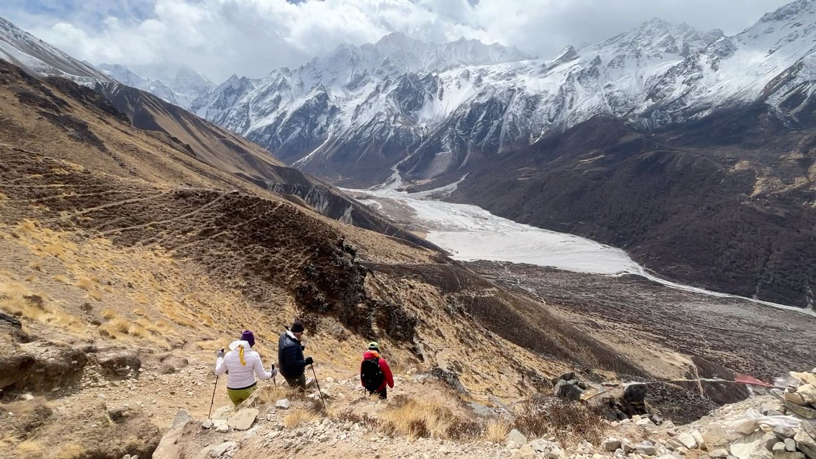 Trekkers crossing trails during the Langtang Valley Ganja La Pass Trek with panoramic Himalayan mountain views in Nepal