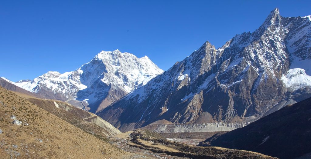 Golden sunrise illuminating Mount Manaslu in the Himalayas, a majestic peak among the 14 highest mountains in the world