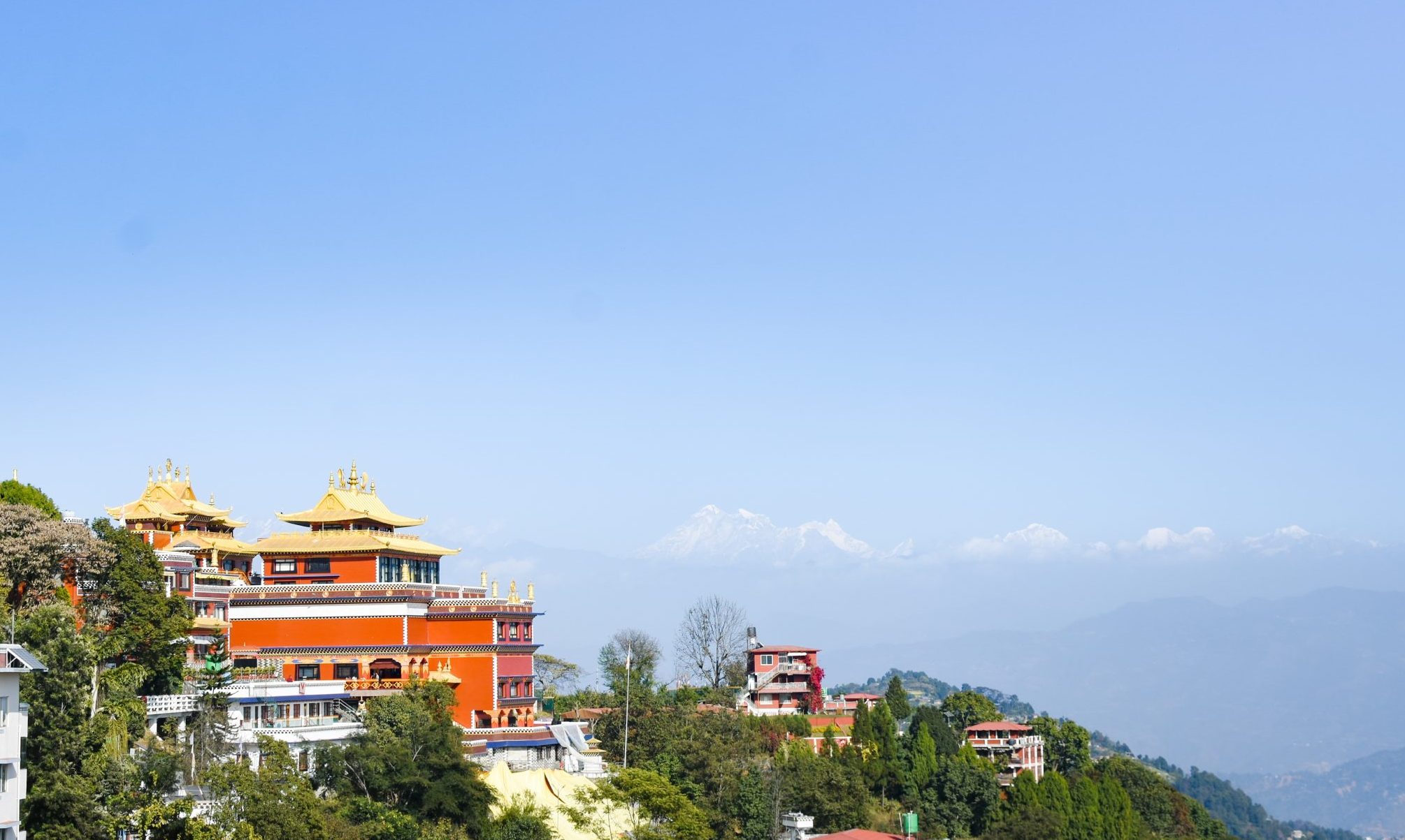 Stunning view of Namobuddha monastery on a hilltop with distant Himalayan mountains