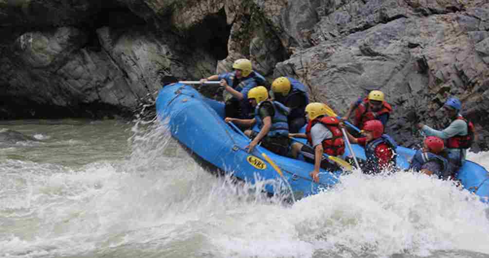 Rafting team riding powerful rapids on the Trishuli River in Nepal