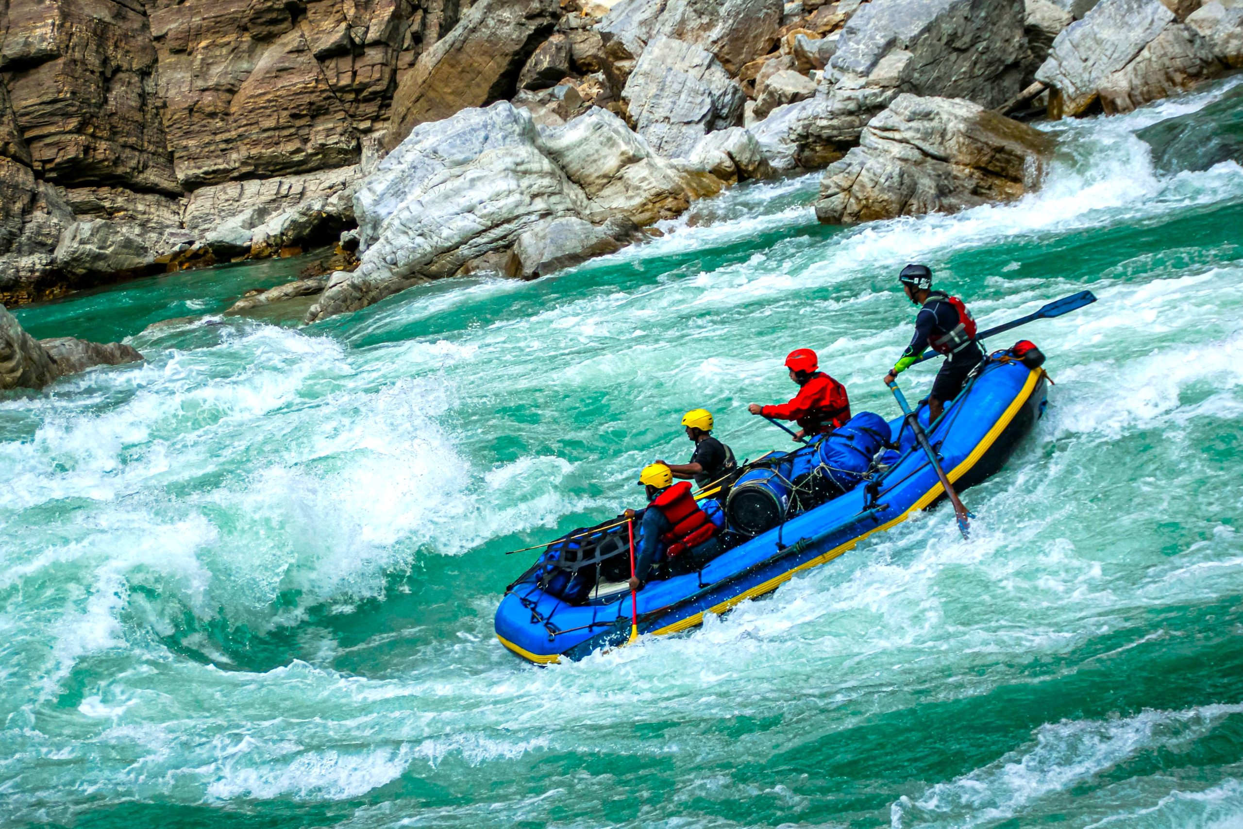 Adventurers go white-water rafting on the Bhote Koshi River, one of the most thrilling and fun things to do in Nepal.