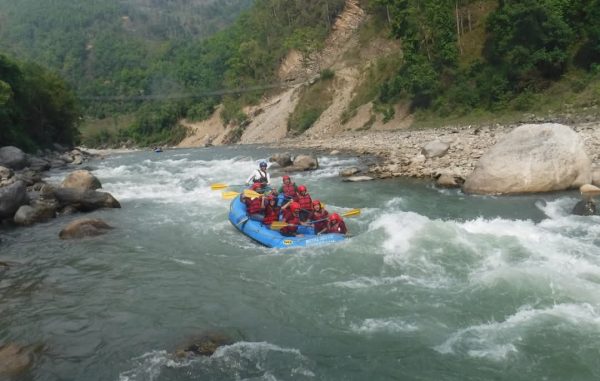 Adventurers go white-water rafting on the Bhote Koshi River, one of the most thrilling and fun things to do in Nepal.