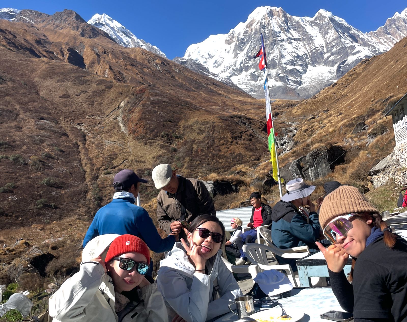 Trekkers resting at Annapurna Base Camp before heading to Mardi Himal Base Camp