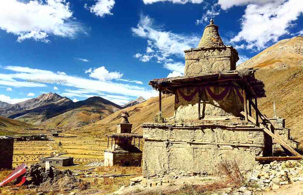 Amazing chorten with hay stacks, mountains, and valley view