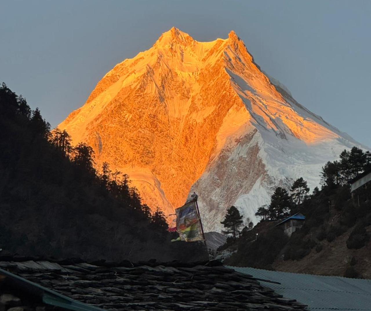 Golden sunrise over Mount Manaslu with breathtaking Himalayan views during the Manaslu Circuit Trek in Nepal