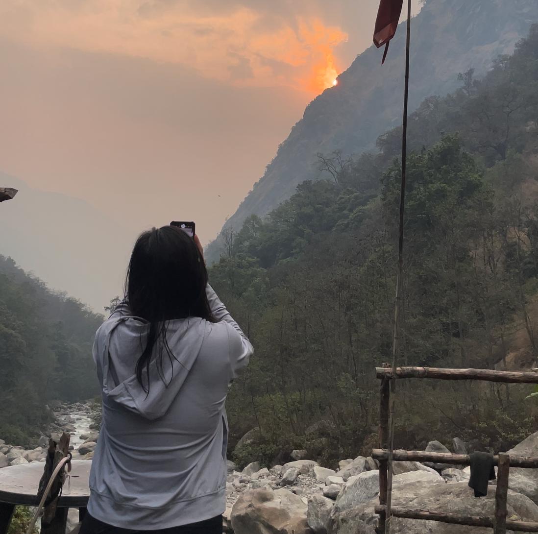 Trekkers watching sunrise over mountains Langtang Valley Trek Nepal