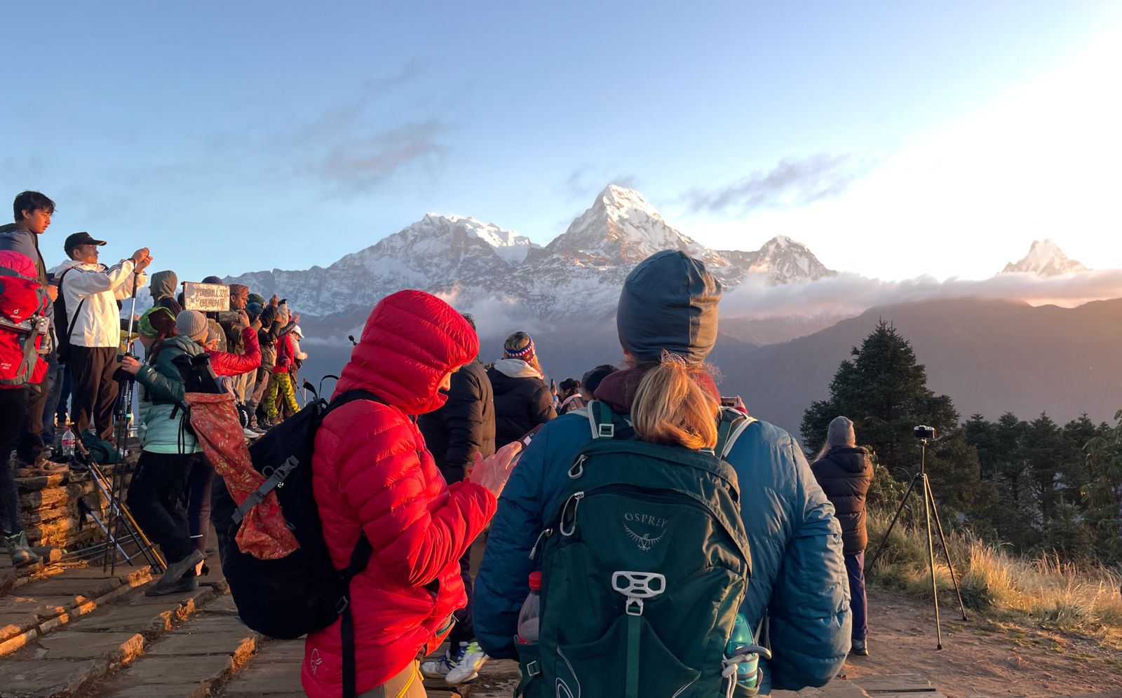 Trekkers enjoying panoramic sunrise view of Annapurna Himalaya range from Poon Hill (3,210 m / 10,531 ft) during Annapurna Sanctuary Trek