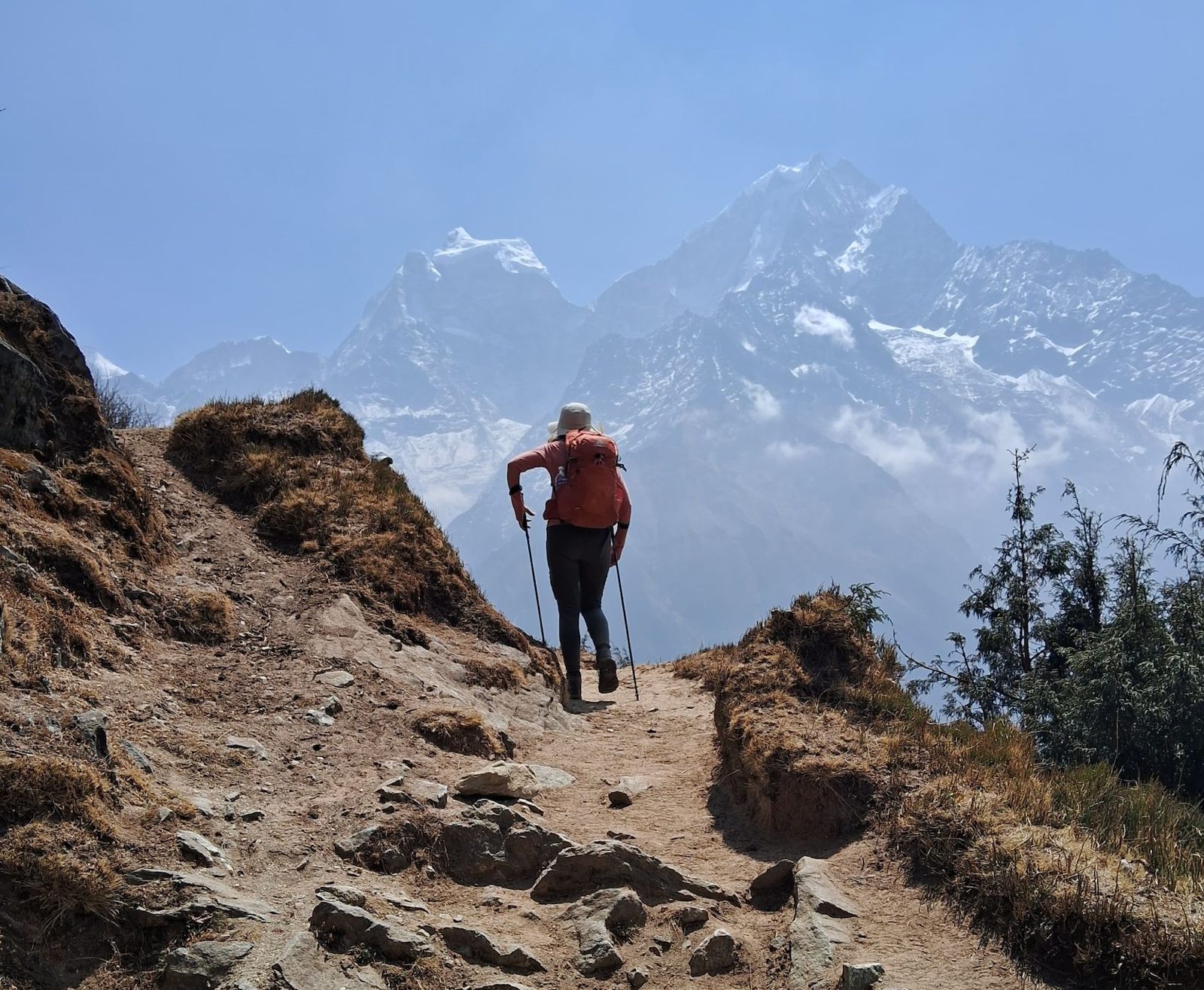 Trekkers walking towards Everest View Point with panoramic Himalayan scenery on the Luxury Everest View Trek.