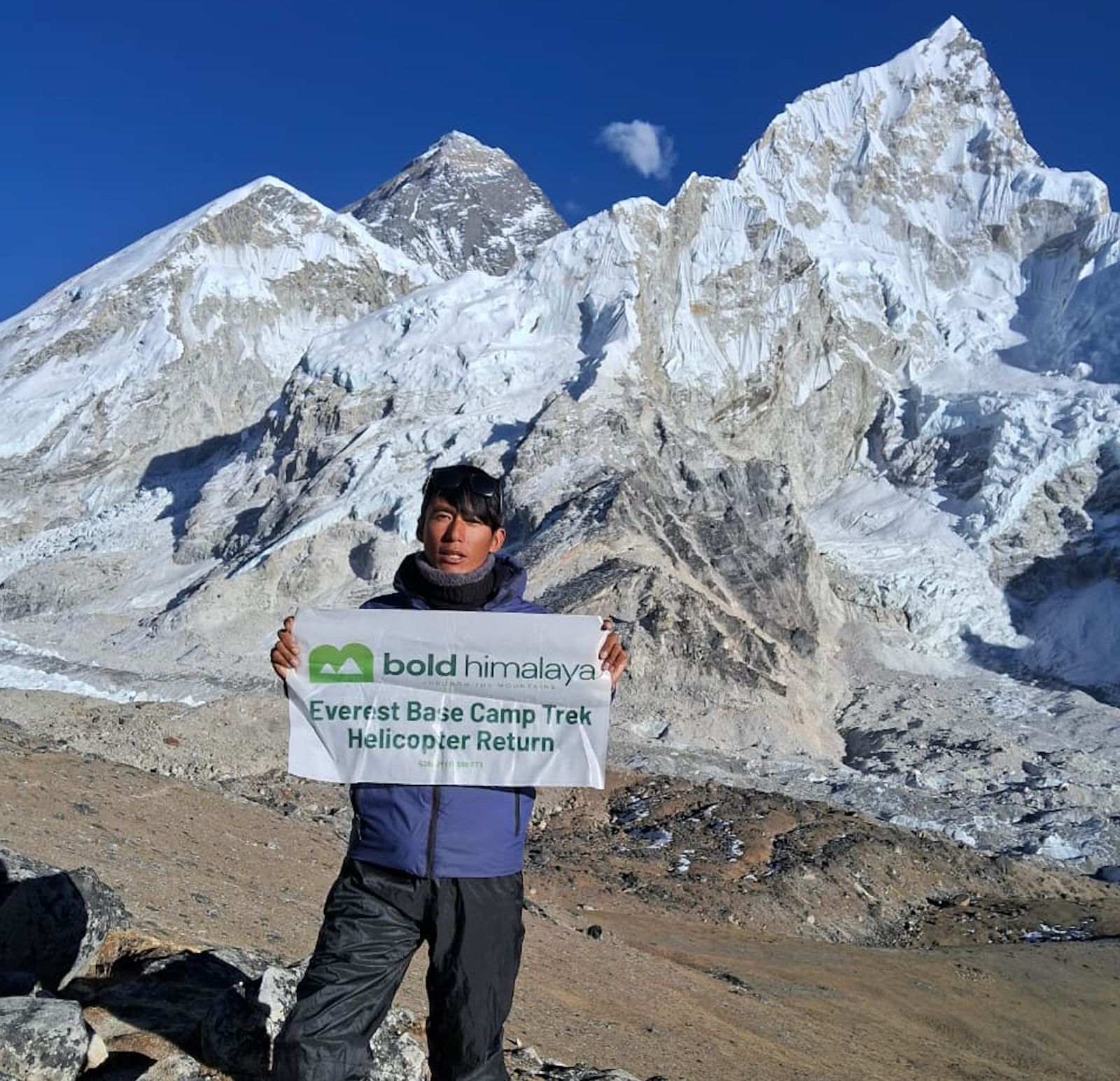 Trekkers standing on Kalapathar with panoramic Everest views before helicopter return to Kathmandu during Luxury Everest Base Camp Trek with Helicopter Return
