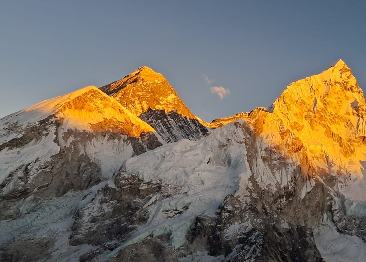 The golden sunset over Mount Everest and Lhotse, as seen from Kala Patthar – a magical moment in the heart of the Himalayas during Everest Base Camp Trek with Helicopter Return