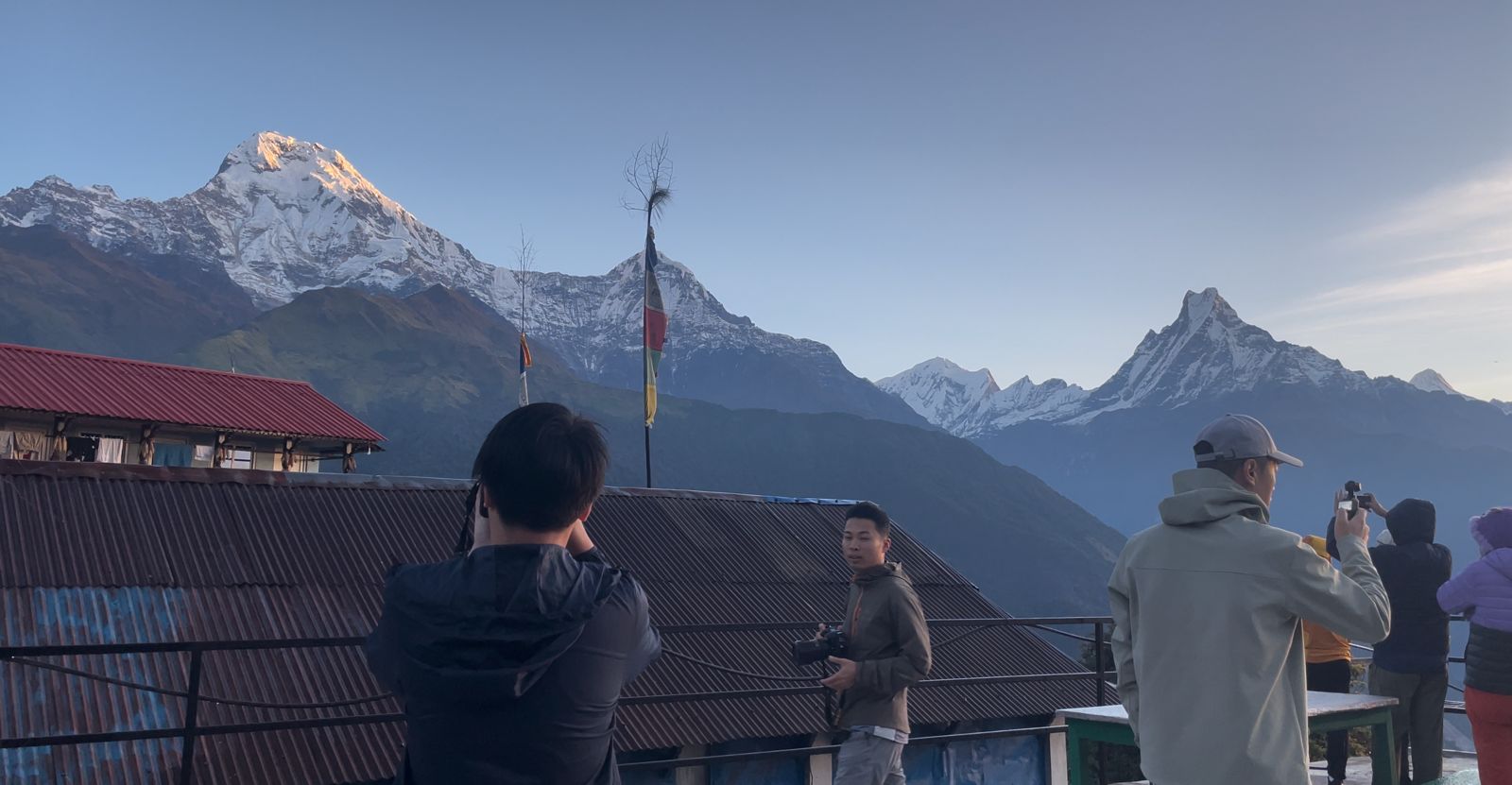 Sunrise over Himalayan peaks from Tadapani village on the Annapurna Sanctuary Trek trail in Nepal.