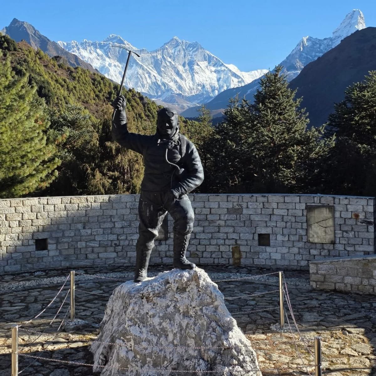 Statue of Tenzing Norgay in Namche Bazaar with the Kongde Himal range, seen on the Everest Base Camp Trek with Kongma La Pass.