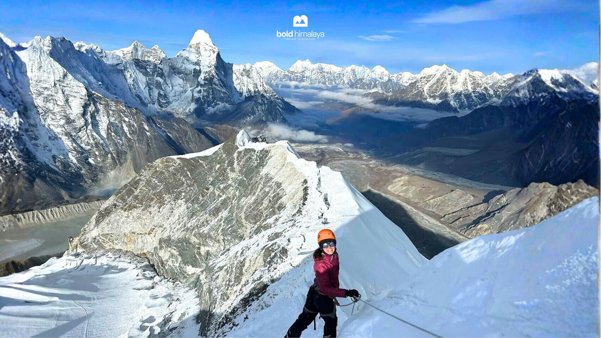 Conquering the heights during the Everest Base Camp Trek with Island Peak Climbing, standing atop a snowy Himalayan ridge with breathtaking panoramic views of towering peaks and deep glacial valleys.