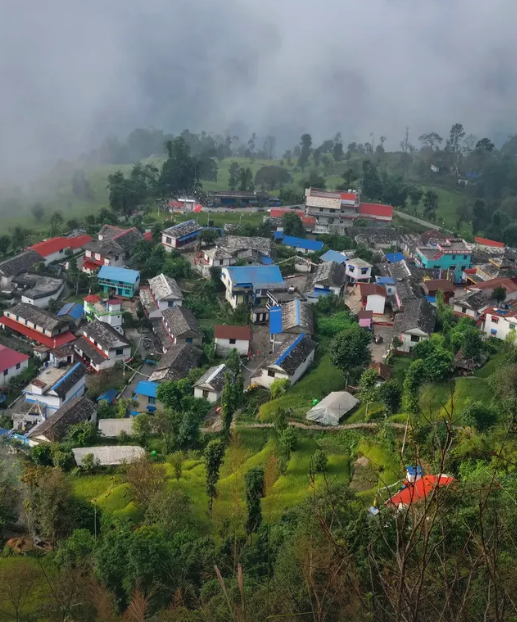 Colorful rooftops of Sirubari Village surrounded by terraced hills and misty forests, showcasing traditional Gurung architecture and rural charm in Nepal-Best Hiking Trails Around Pokhara Valley
