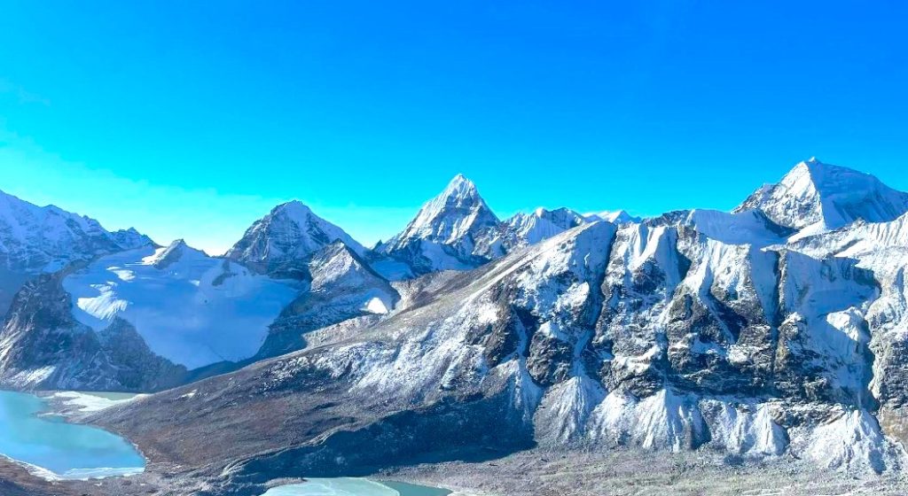 Amphu Lapcha Pass at 5,845 m with snow-covered glaciers and panoramic Himalayan peaks, challenging treks in Nepal