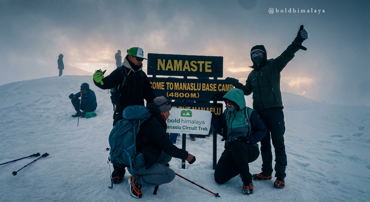 Team of Bold Himalaya at Manaslu Base Camp during the Manaslu Circuit Trek, standing with a licensed guide