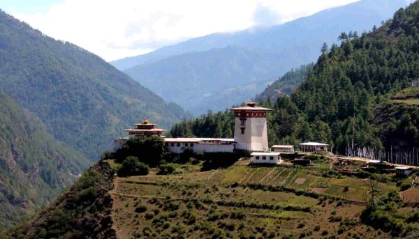 Panoramic view of Drukgyel Dzong perched on a hillside in Paro Valley, one of the places to visit in Bhutan