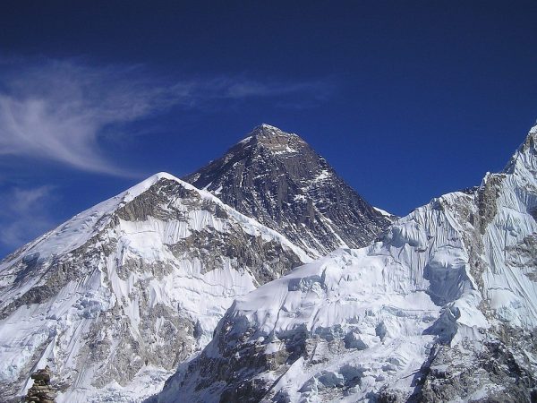 Mount Everest in the Himalayas, with a snow-covered peak and surrounding mountains, showing key Mount Everest facts and information