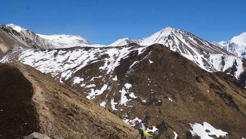 Snow-covered Himalayan mountains viewed from Ganja La Pass Trek, Langtang, Nepal, with clear skies and pristine alpine landscape