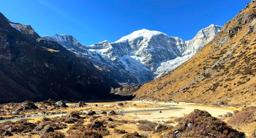 Snow-capped Mount Jomolhari rising above alpine meadows and glacial valleys in western Bhutan, one of the best places to visit in Bhutan