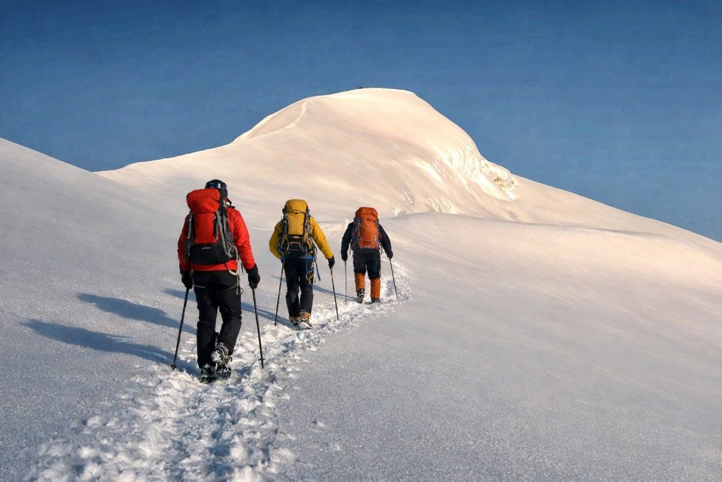 Climbers trekking toward Mera Peak, one of the easy peaks to climb in Nepal