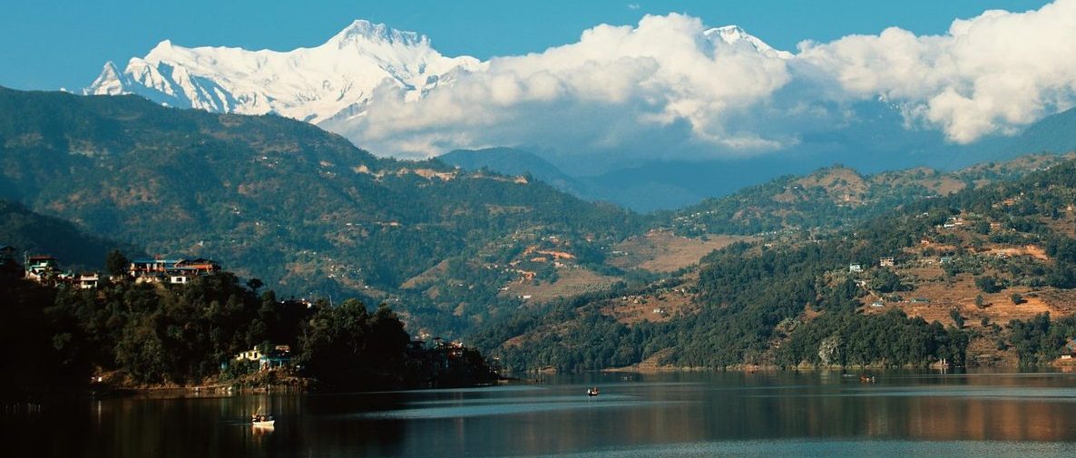Snow-capped Annapurna mountains reflecting over the lake of Phewa Lake, one of the most iconic places to visit in Pokhara