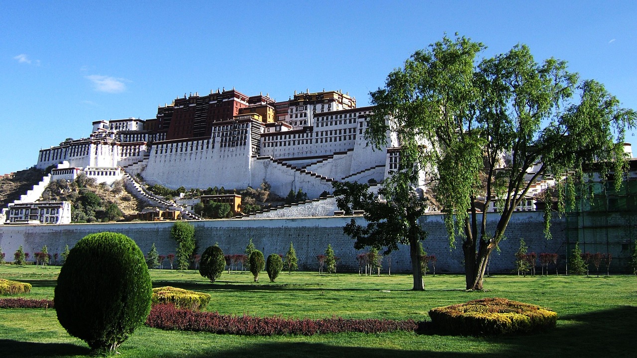 Potala Palace in Lhasa, Tibet, glowing under a clear blue sky during the best time to visit Tibet in autumn