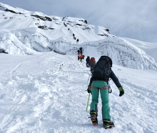 Mountaineers ascending a snowy ridge toward Island Peak’s summit-Island Peak Climbing