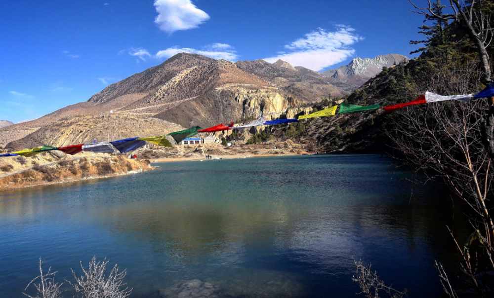 Mountain lake with prayers flag
