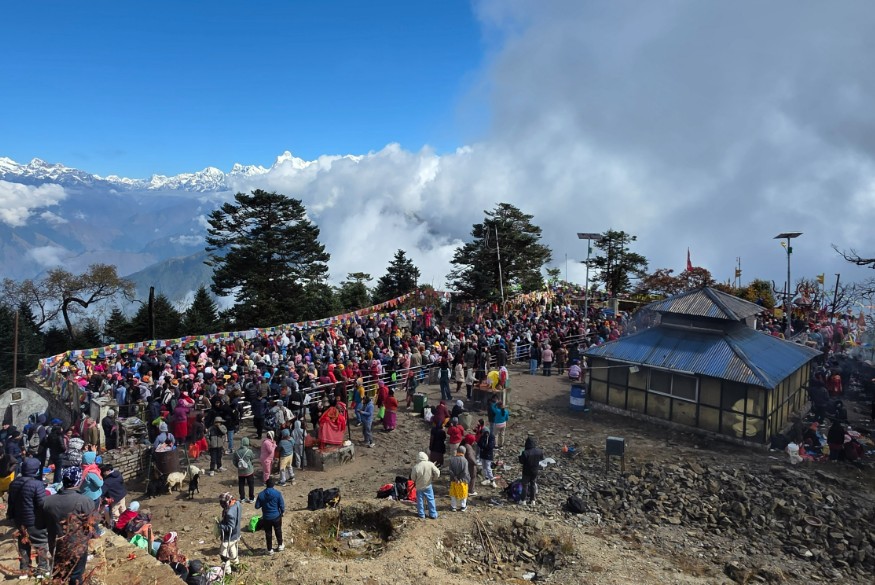 Devotees praying at Pathibhara Temple with stunning Himalayan mountains in the background during a Helicopter Tour from Kathmandu.