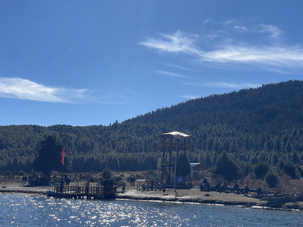 Rara Lake Trek in Nepal, showcasing pristine lake waters, snow-capped Himalayan peaks, and tranquil alpine scenery – a best trek in Nepal experience