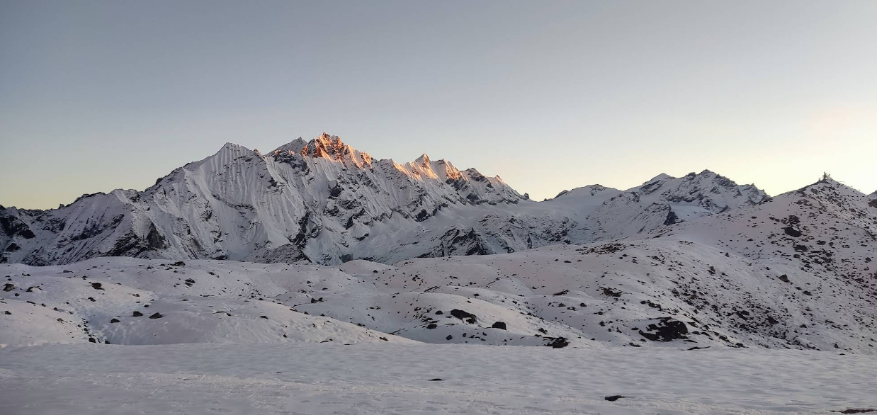 Snow-covered mountain landscape at sunrise during Yala Peak Climbing and Yala Peak Expedition in the Langtang Himalayas, Nepal.