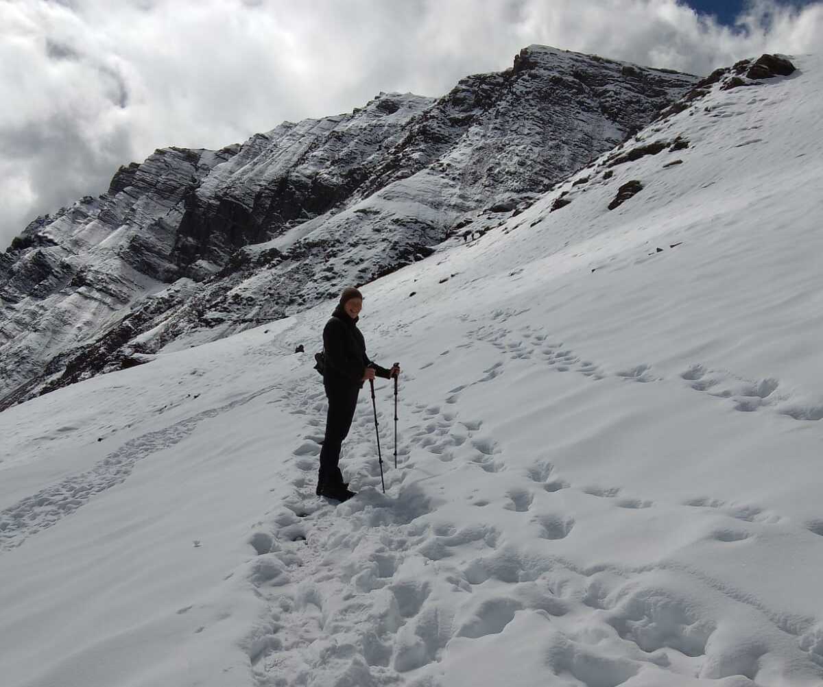 Trekkers heading to Kang La Pass at 5,306 m / 17,400 ft along snowy routes during the trek in Nepal