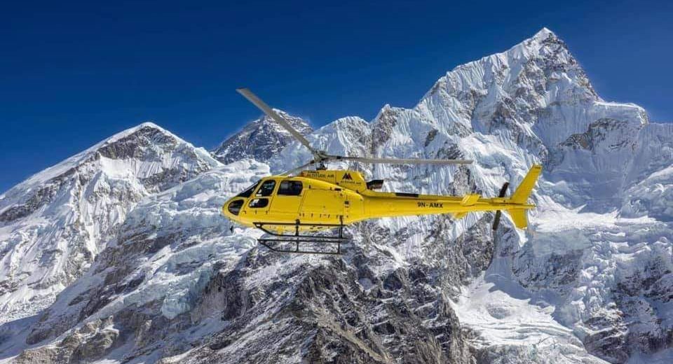 Helicopter flying over the majestic Mount Everest during a Helicopter Tour from Kathmandu, offering panoramic Himalayan views.