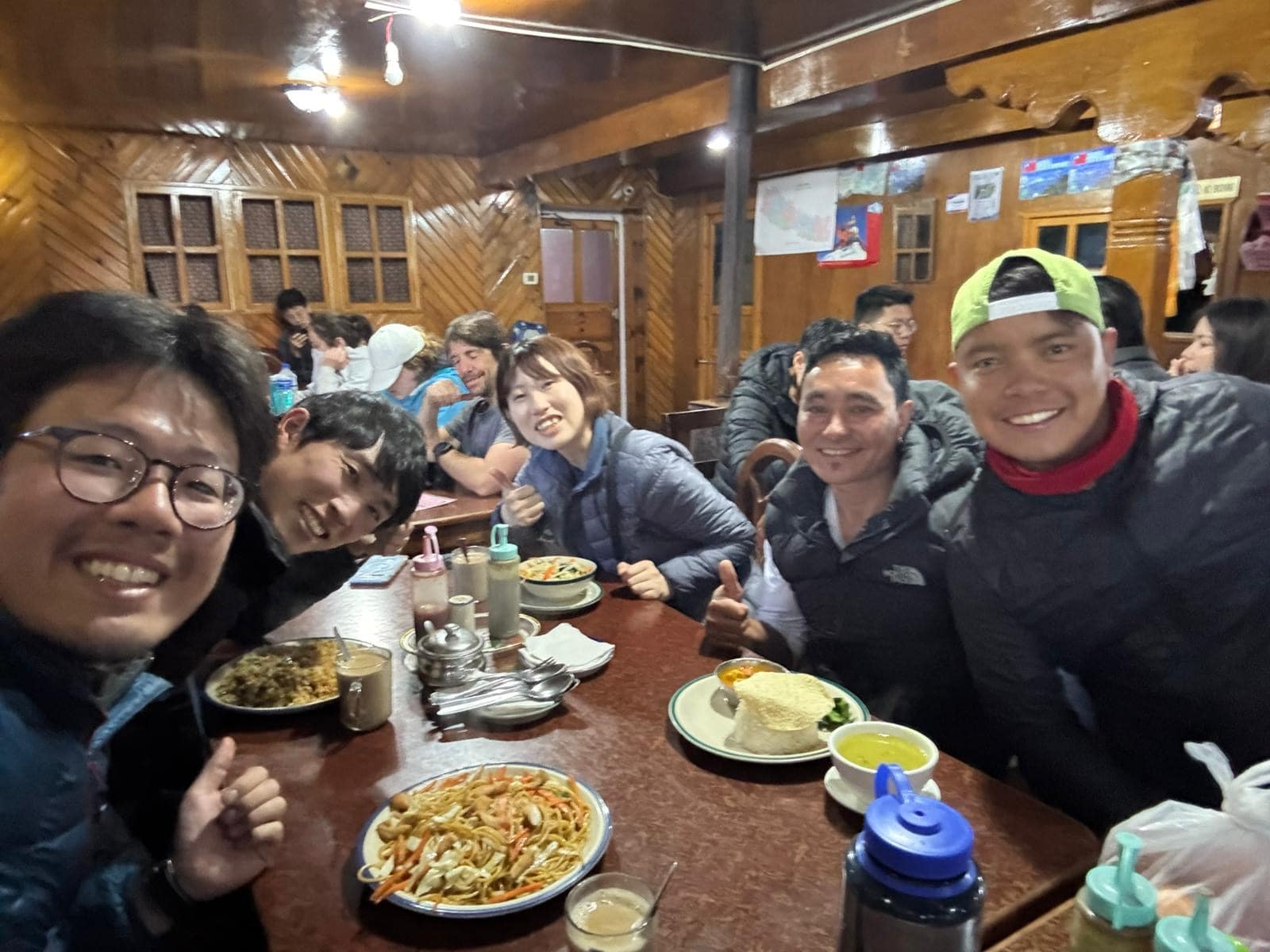 The Everest Base Camp trekking team eating meals at a tea house lodge in the Himalayas