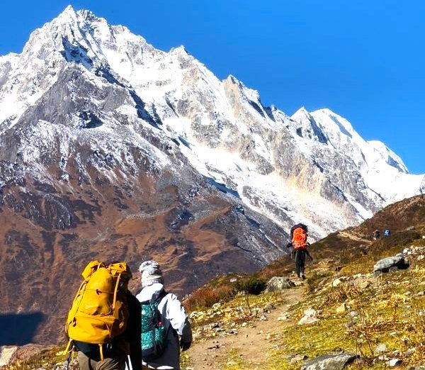 Panoramic view of the snow-capped Manaslu Range on the Manaslu Circuit Trek, one of the Monsoon treks in Nepal